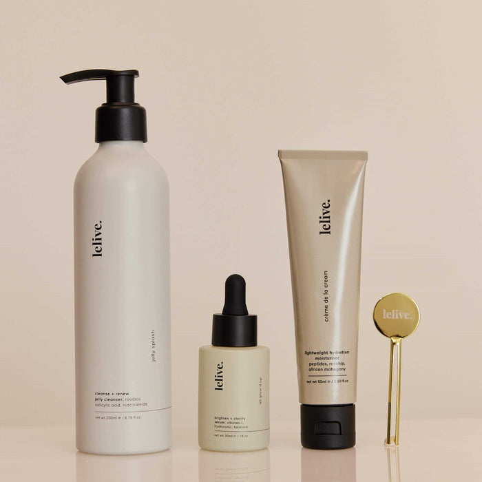A collection of three skincare products from lelive. a jelly cleanser, brightening serum and peptide moisturiser including a tube key roller.