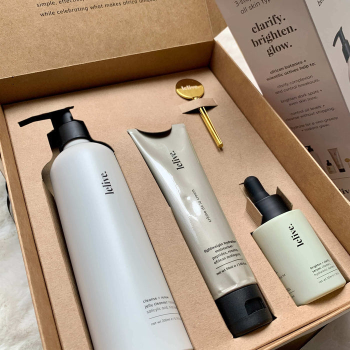 A collection of three skincare products from lelive. a jelly cleanser, brightening serum and peptide moisturiser including a tube key roller.