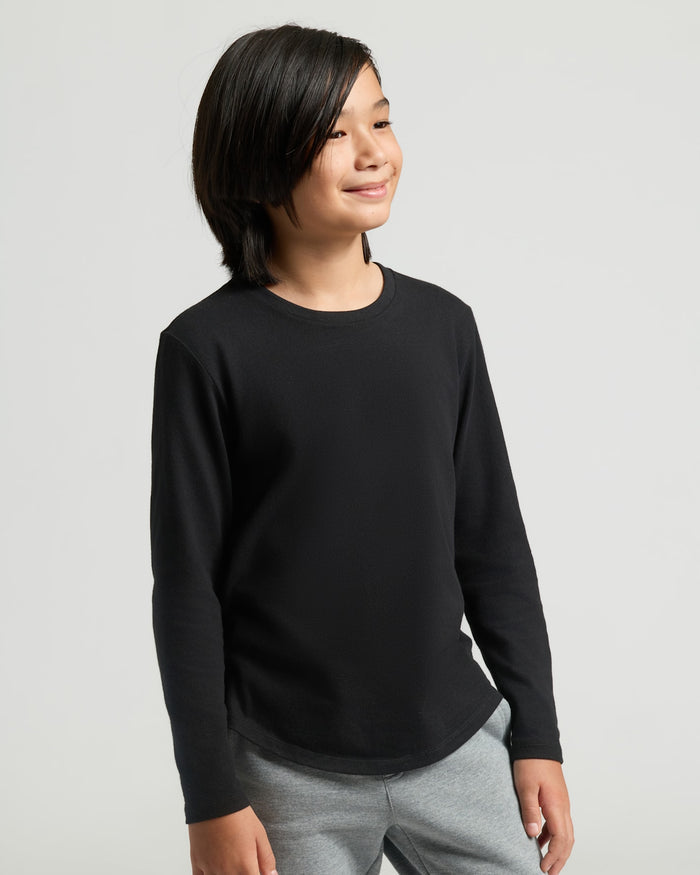 Boys' Black Classic Long Sleeve Curved Hem Crew on young model.