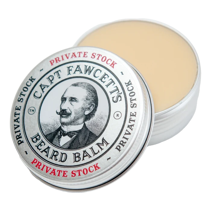 Åpen Captain Fawcett Private Stock skjeggpomade i metallboks med cremefarget balm