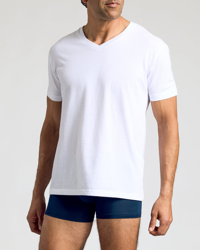 Carbon Boxer Trunks 12-Pack: Man in white V-neck T-shirt, navy boxer-briefs.