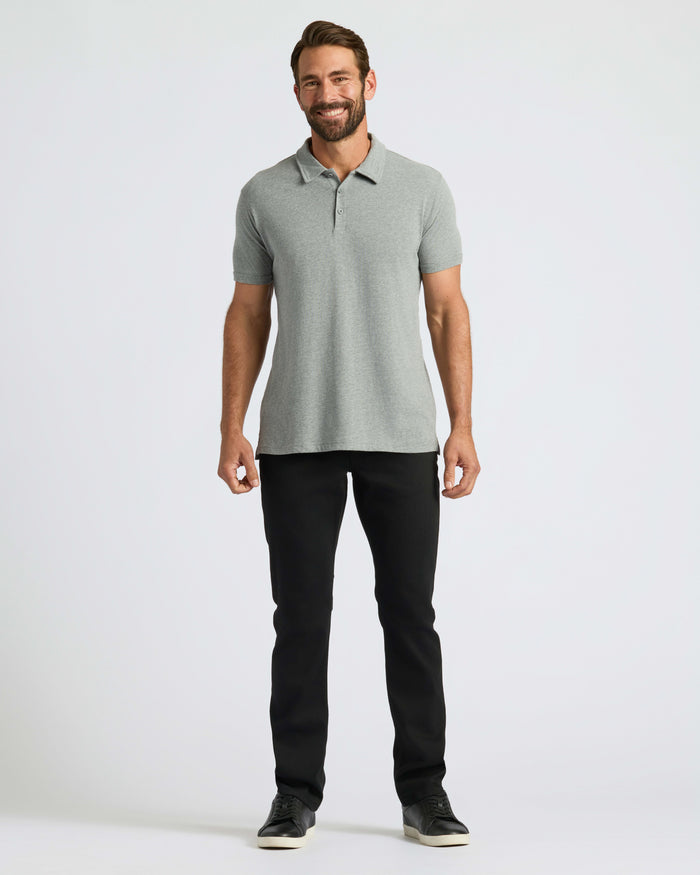 Man wearing Classic Polo with slim-fit pants and sneakers.