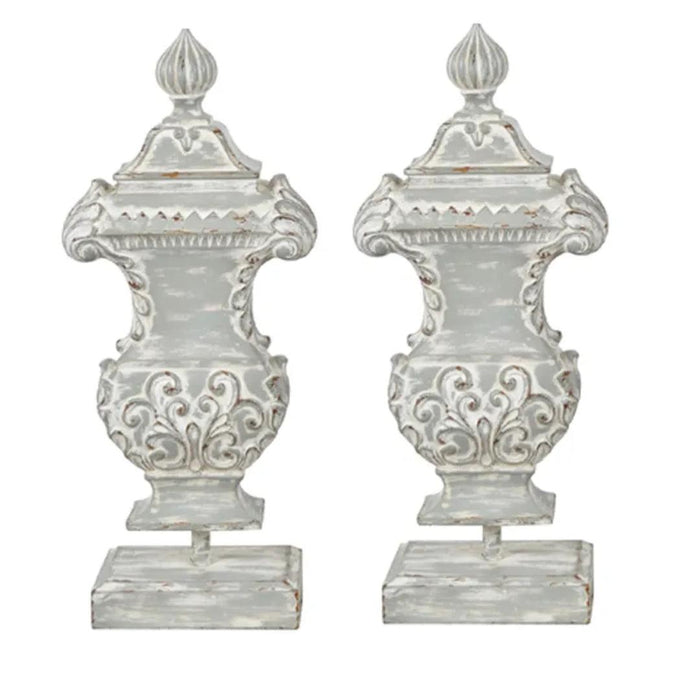 Distressed white ornate urns with scrollwork, perfect for French country or shabby chic decor