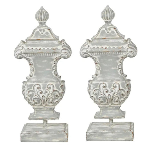 Distressed white ornate urns with scrollwork, perfect for French country or shabby chic decor