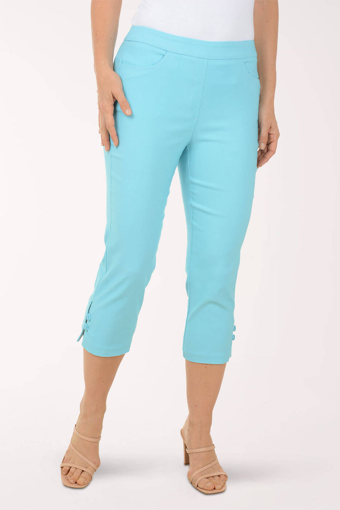Light blue capri pants worn by a person on a white background