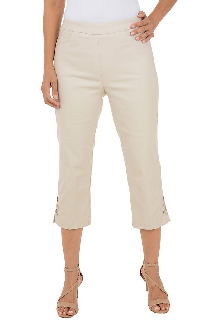 Beige capri pants worn by a person on a white background