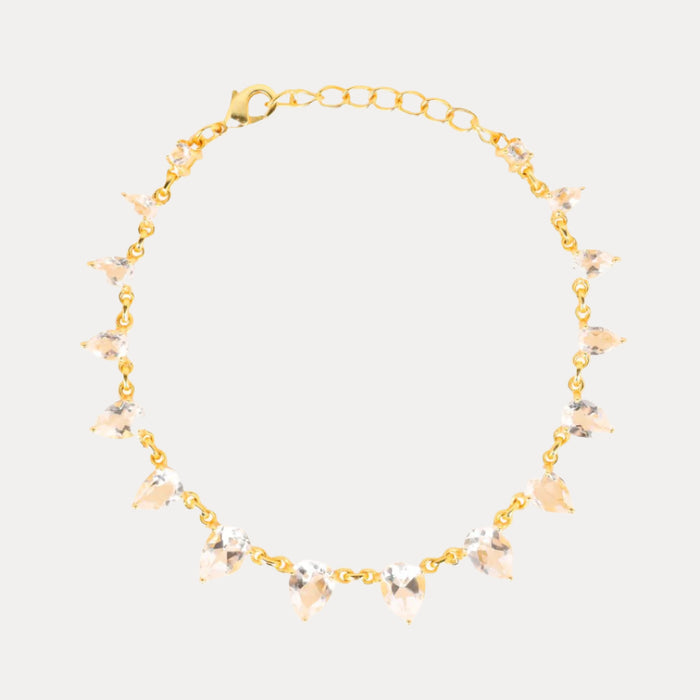 a gold necklace with crystals