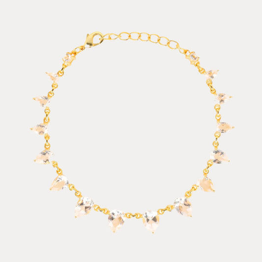 a gold necklace with crystals