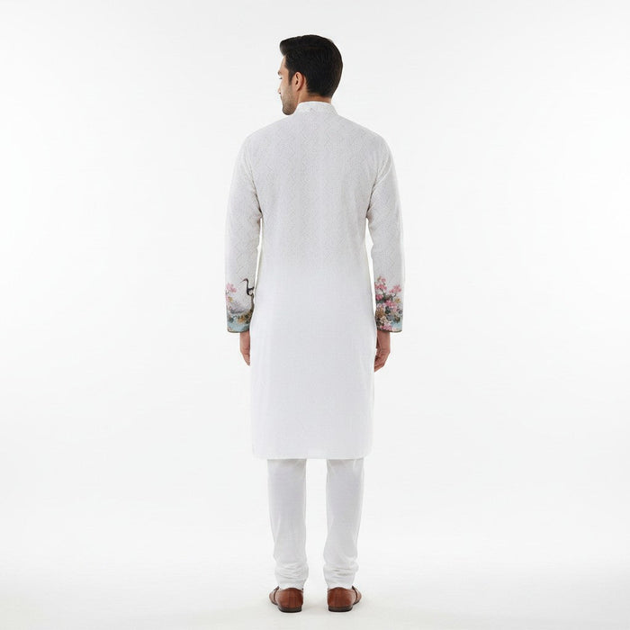 Kurti Connection USA white embroidered kurta with floral and crane printed sleeves and hem for men.