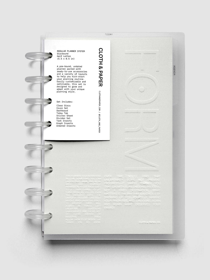 Closed Forma Modular Planner System in Half Letter (top) and open in CP Petite (bottom) against a dark background.