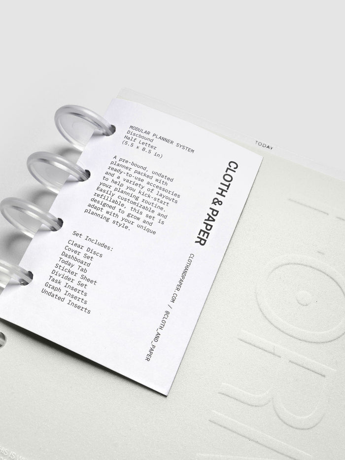 Forma Modular Planner System in CP Petite shown on top of Half Letter against a black background.