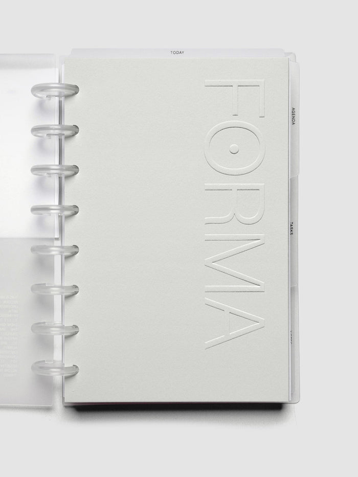Close up view of the Forma Modular Planner System side tab dividers labeled agenda, tasks, and notes.