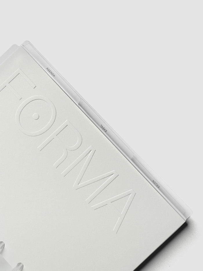 Close up view of the packaging label of the Forma Modular Planner System in Half Letter with details of what's included in the system.