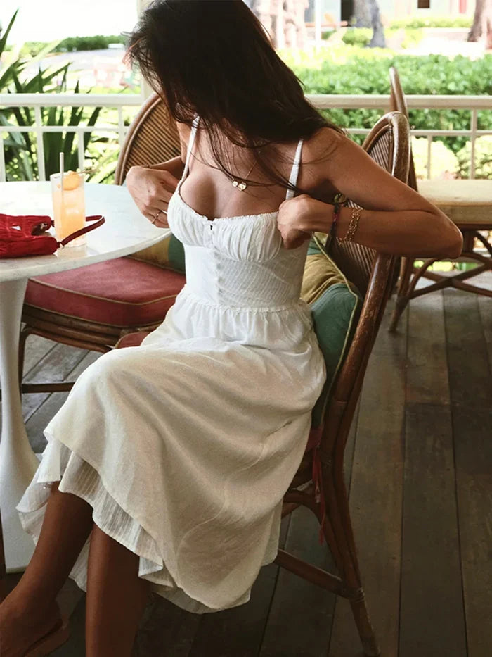 Iris | Solid color midi dress with thin straps and ruffle at the hem