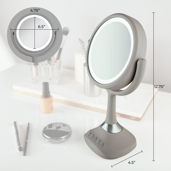 Zadro LEDBTV2001 705004422215 environment photo side view on vanity table with dimensions, lighted makeup mirror with magnification, bluetooth & usb in front of a real life setting