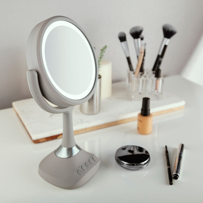 Zadro LEDBTV2001 705004422215 environment photo overhead view on bedroom vanity table, lighted makeup mirror with magnification, bluetooth & usb in front of a real life setting