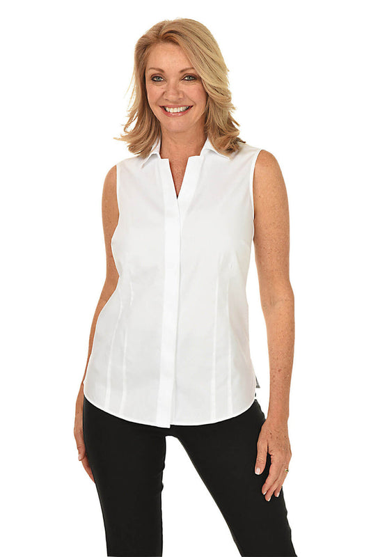 A front shot of a model sleeveless white blouse with a classic foldover collar, full button-front, and a covered placket. It has a rounded hemline with a 3-inch side slit on the hemline.