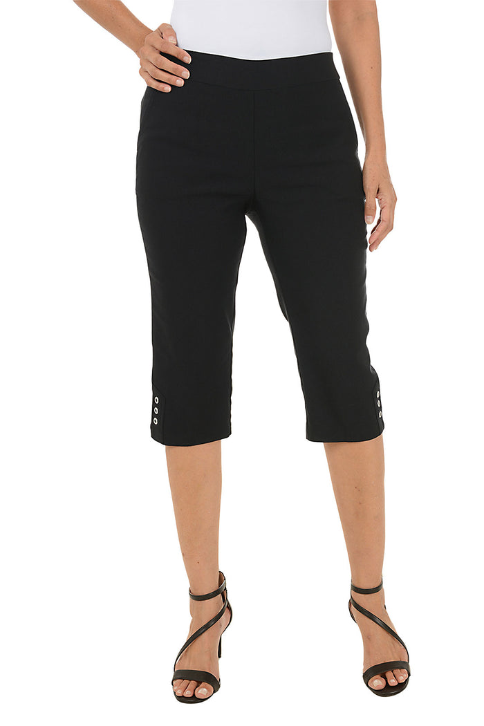 A woman wearing black cropped capri pants.