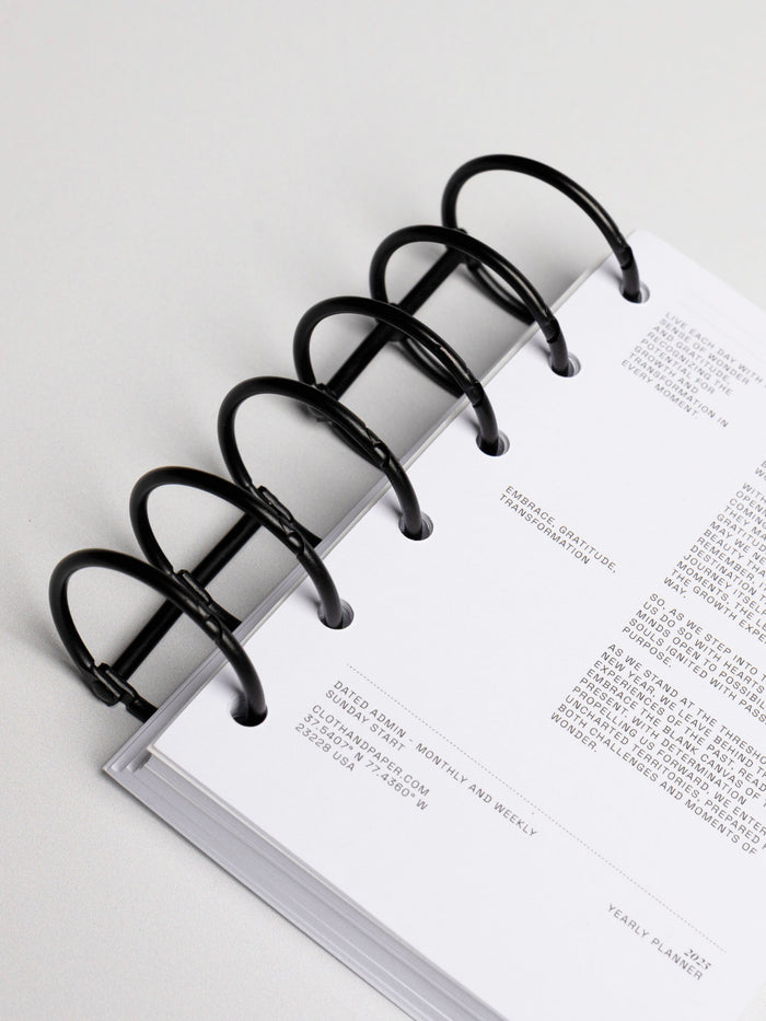 Planner rings displayed in a planner system on a neutral background. Color shown is black.