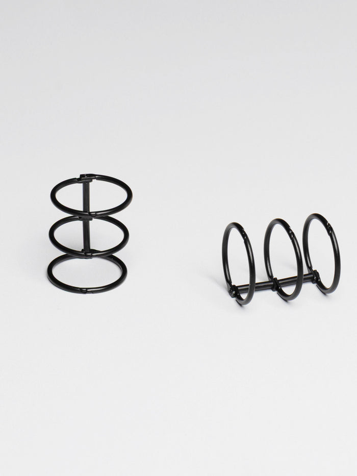 Planner rings displayed on a neutral background. Color shown is black.