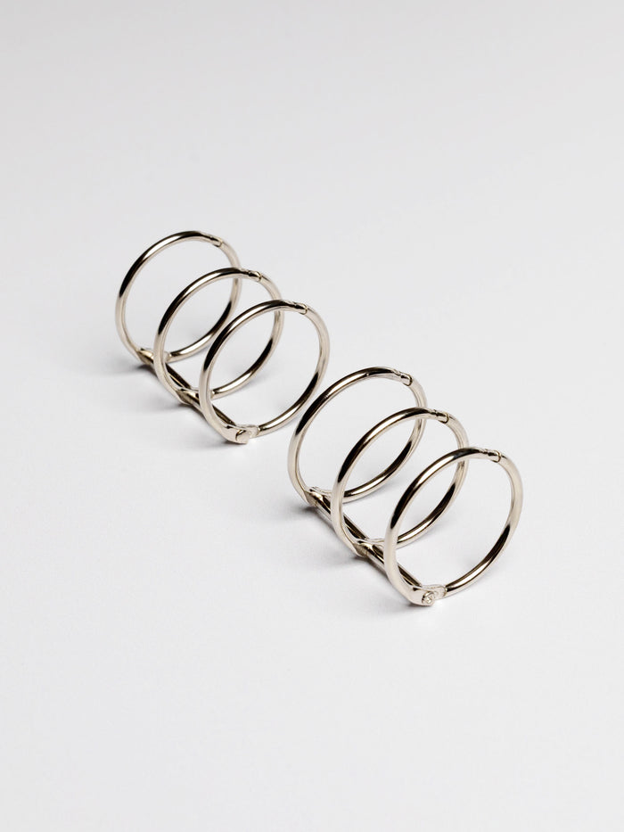 Planner rings displayed on a neutral background. Color shown is silver.
