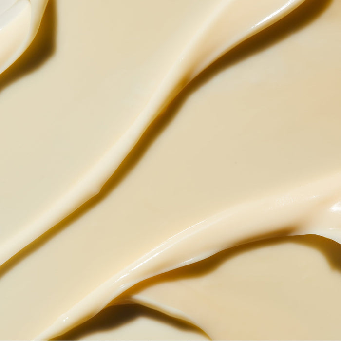 Smooth beige cream texture spread evenly, showcasing the rich consistency of Rejuvenating Night Cream | Omorovicza for luxurious skincare use.