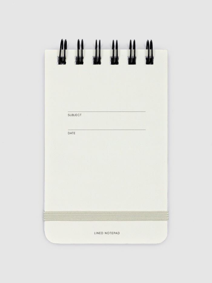 Lined notepad displayed on a white background.