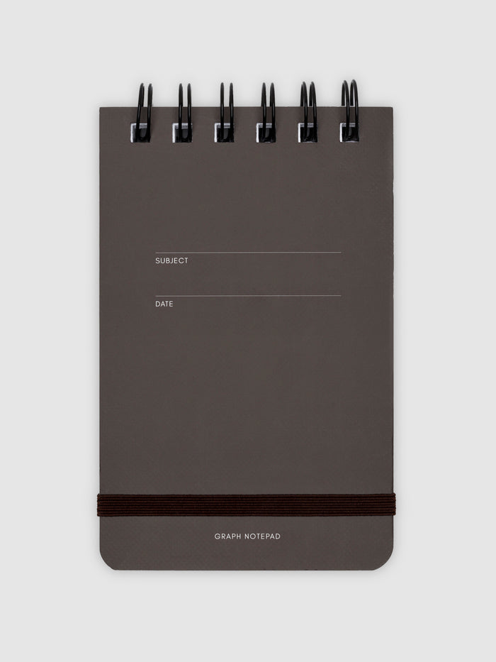 Graph notepad displayed on a neutral background.
