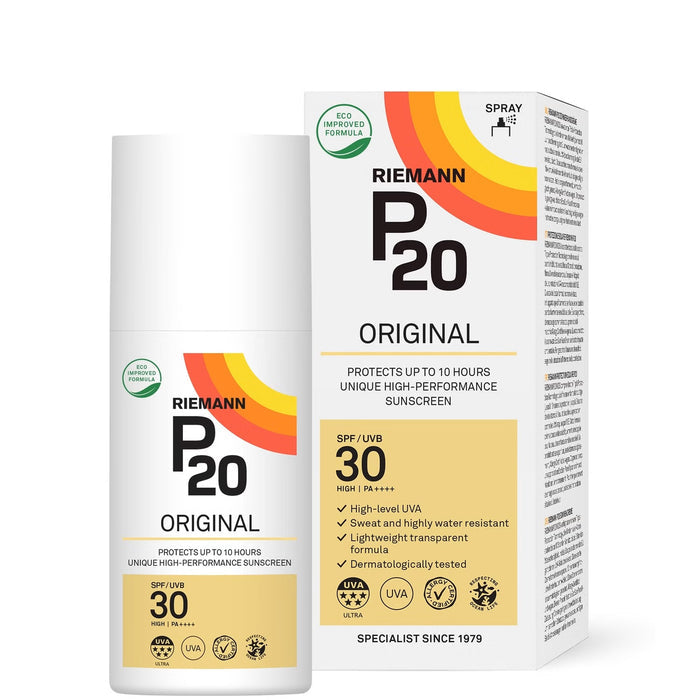 Riemann P20 SPF30 sunscreen spray 200ml bottle with triple protection and sweat resistance, shown in a natural outdoor setting