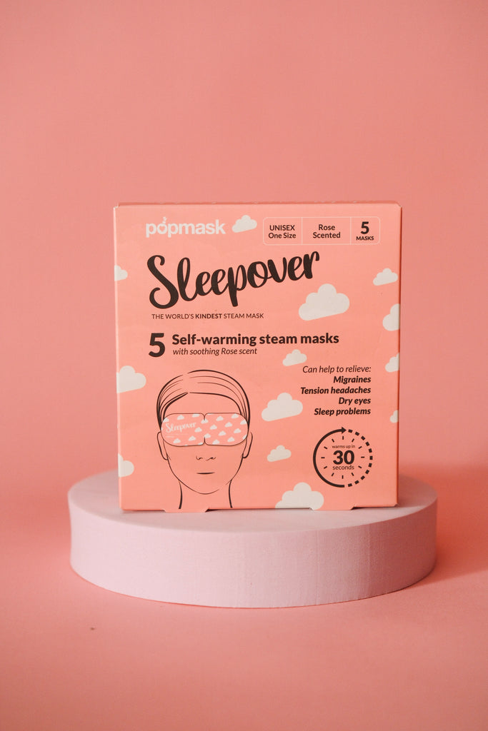 Sleepover Self Warming Steam Mask | Popmask package in soft pink with rose scent, designed for skincare and wellness to relieve migraines, tension headaches, dry eyes, and sleep problems.