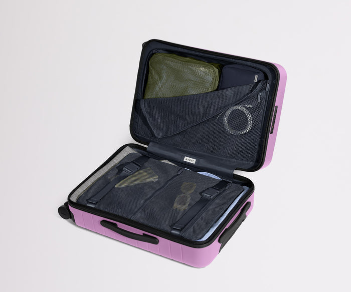 The Bigger Carry-On | Taffy Purple
// New pockets added to our signature interior compression system, so you can stay more organized. Paired with The Insider Packing Cubes (Set of Four).