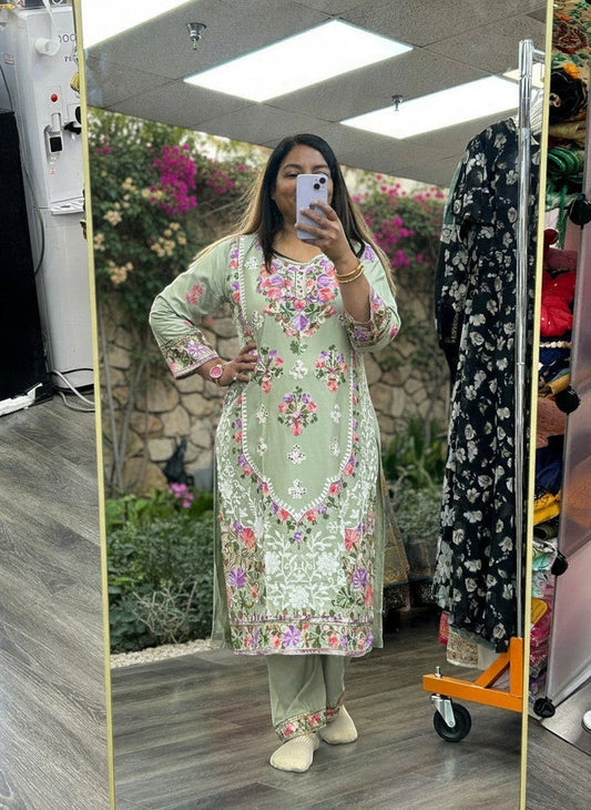 Kurti Connection USA sage green kurti set with multi-colored floral embroidery, round neck, and matching trousers.