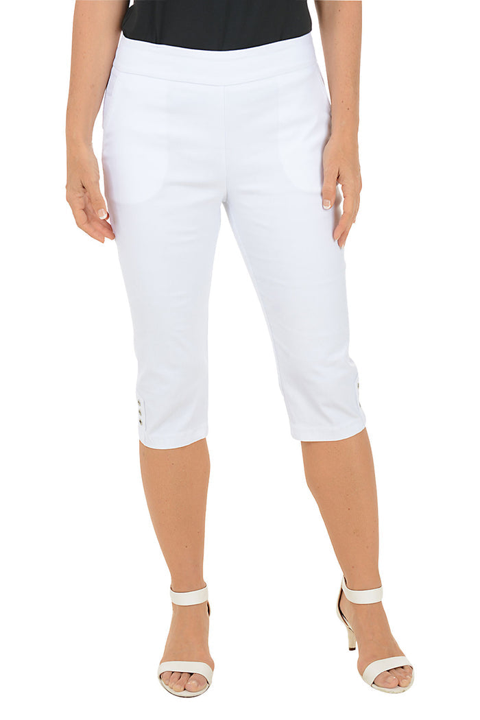 White capri pants worn by a person on a white background