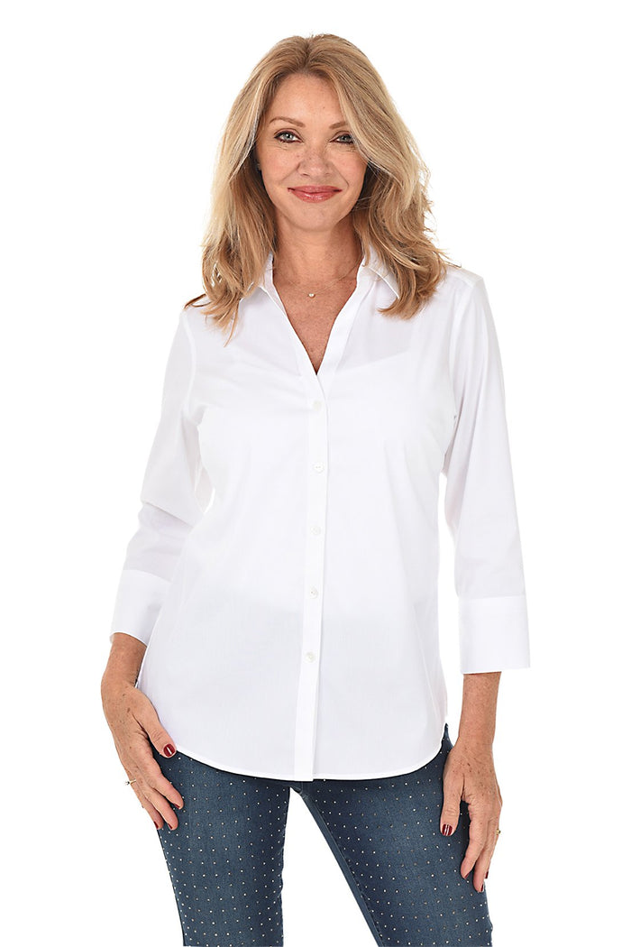 A front shot of a model wearing a white V-neck button-front shirt with 3/4 sleeves and standing against a plain background.