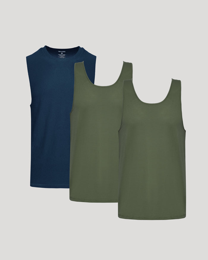 Two tank tops, one navy and one green, on a light gray background