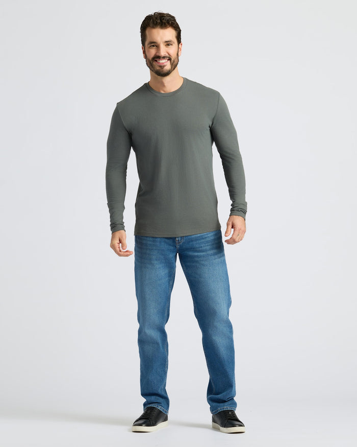 Man wearing Carbon Classic Long Sleeve Crew Neck with jeans and sneakers.