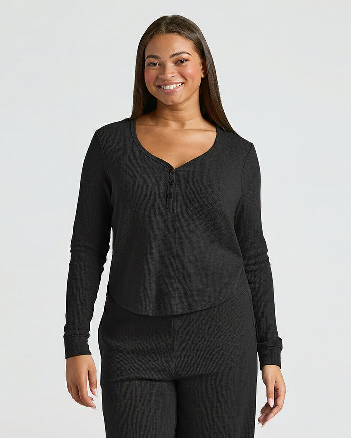 Woman modeling Womens Black Waffle Long Sleeve Boxy Henley set. MODEL_INFO: Jade is 5'9", wearing a size L