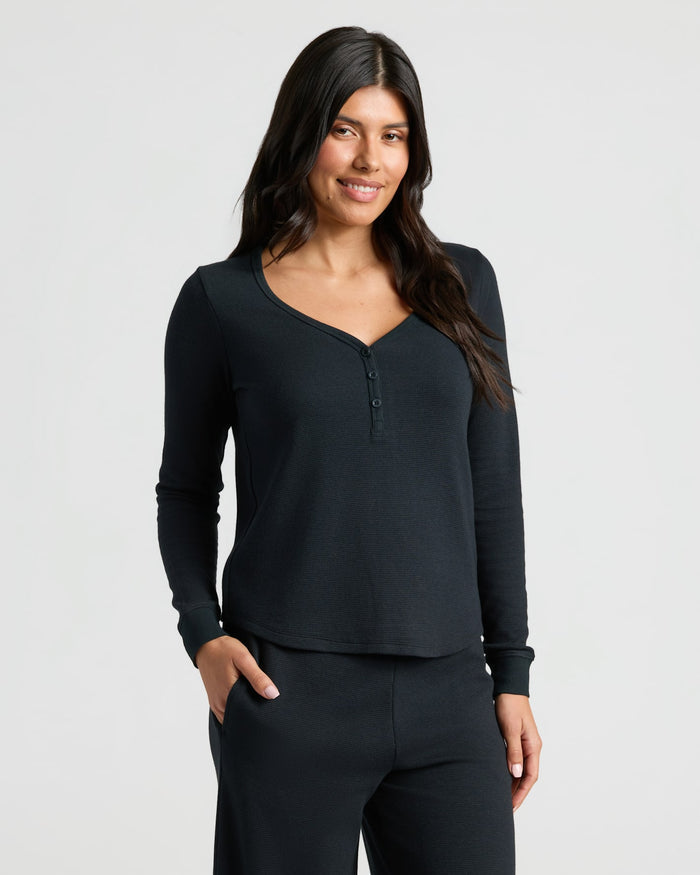 Woman in Womens Black Waffle Long Sleeve Henley & Waffle Leg Pant 2-Pack.