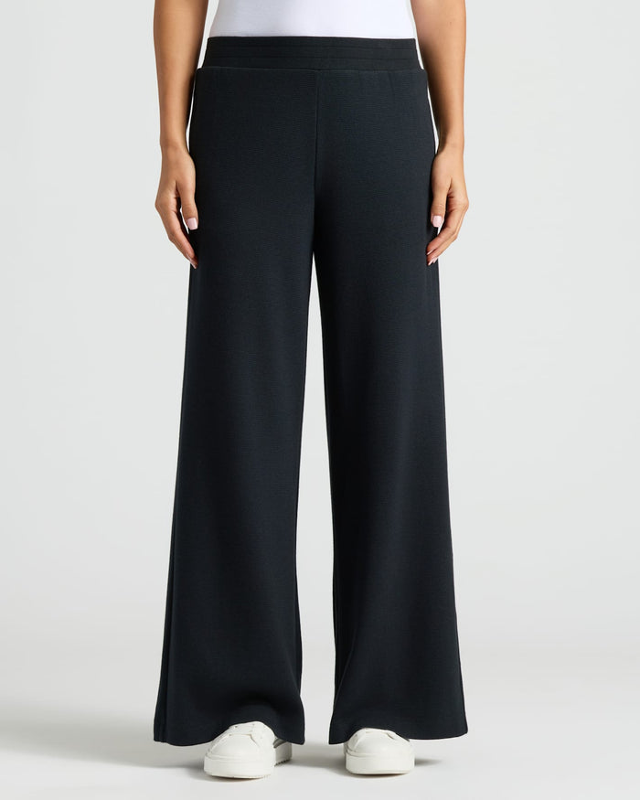 Womens Black Waffle Long Sleeve Henley & Waffle Leg Pant modeled.
