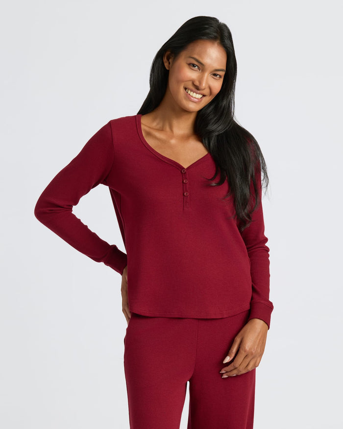 Woman wearing Womens Dark Maroon Waffle Long Sleeve Boxy Henley, smiling. MODEL_INFO: Candy is 5'9", wearing a size S