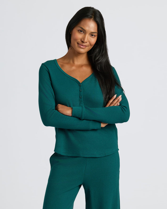 Womens Deep Emerald Waffle Long Sleeve Boxy Henley lounge set worn by smiling woman.