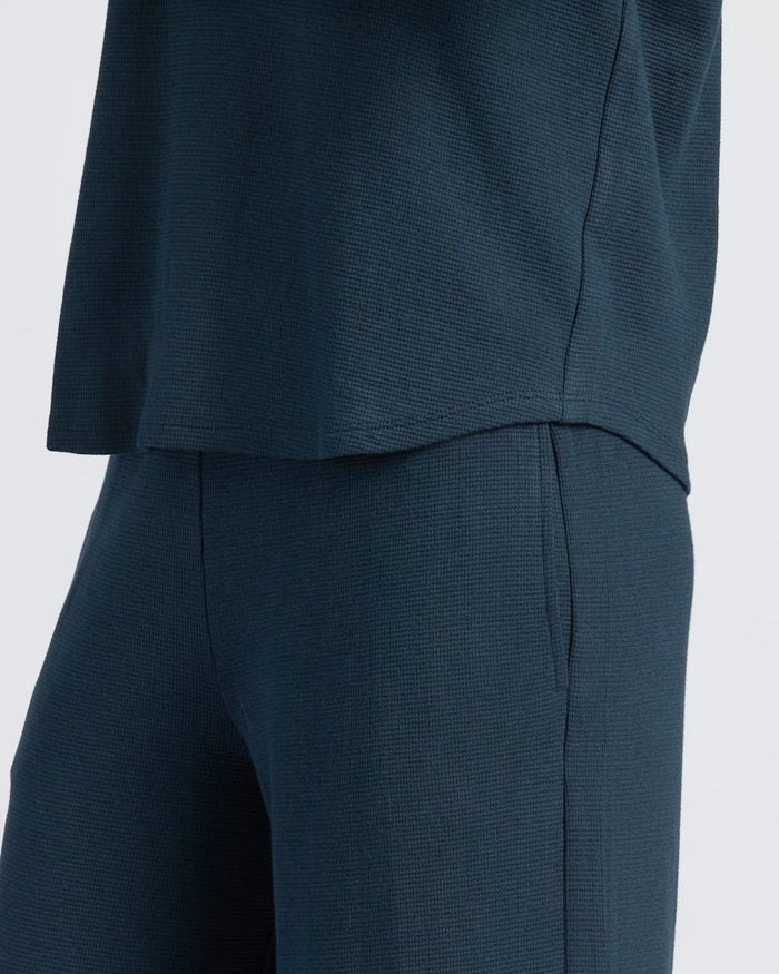 Womens Navy Waffle Long Sleeve Boxy Henley outfit close-up, highlighting fabric texture.