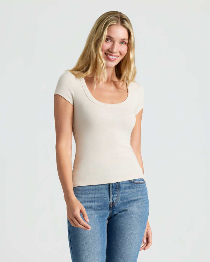 Woman in Womens Ribbed U-Neck Tee 3-Pack smiling. MODEL_INFO: Cora is 5'10", wearing a size S