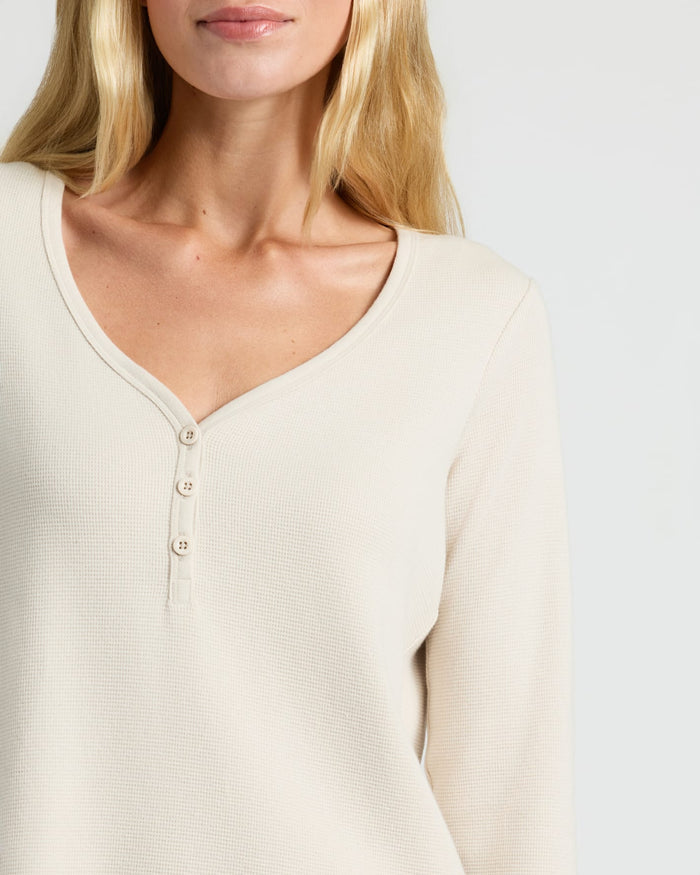 Woman wearing Womens Oatmeal Waffle Long Sleeve Boxy Henley with button placket.