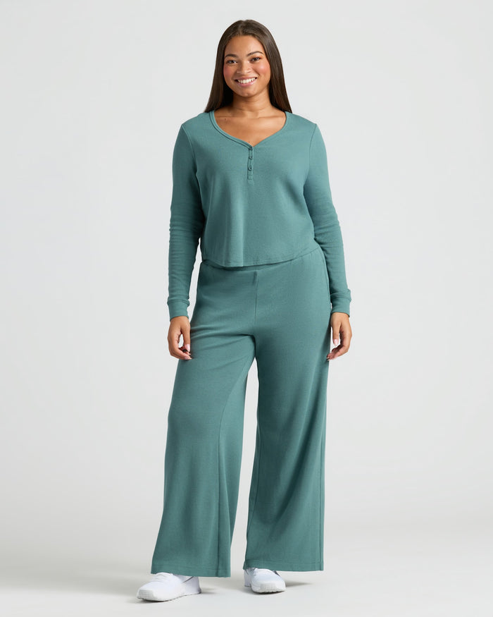 Woman wearing Womens Stormcloud Waffle Long Sleeve Boxy Henley with matching pants.
