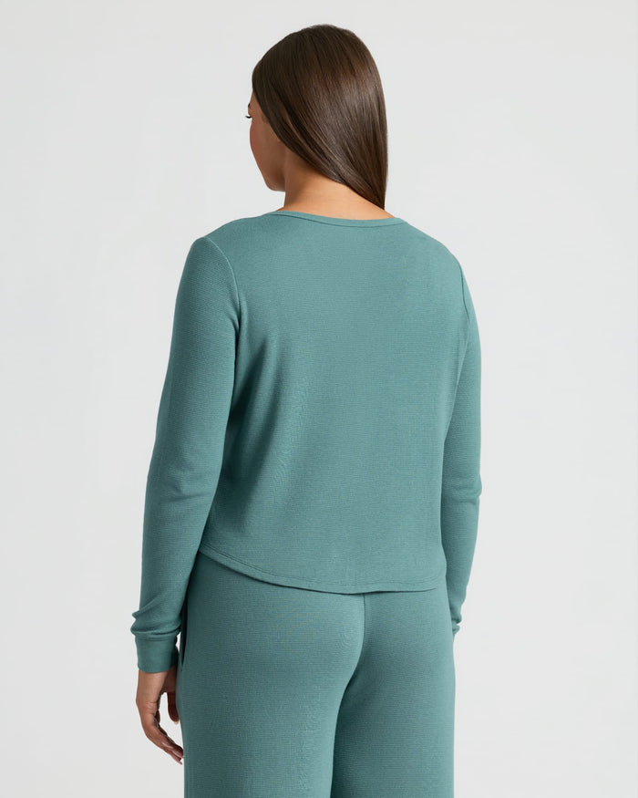 Back view of woman in Womens Stormcloud Waffle Long Sleeve Henley & Leg Pant.